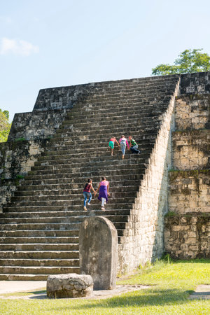TIKAL, GUATEMALA - NOVEMBER 26: Unidentified people climbed mayan pyramid ruins at an archealogical site in Tikal National Park on November 26, 2017 in Tikal.のeditorial素材
