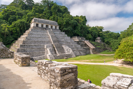 PALENQUE, MEXICO - NOVEMBER 29: Unidentified people explore the mayan temple ruins surrounded by dense jungle on November 29, 2016 in Palenque. Palenque was declared a world heritage site by UNESCO in 1987.のeditorial素材