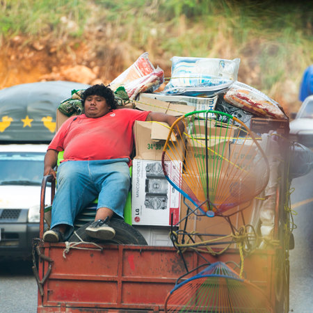 CHIAPAS MEXICO â NOVEMBER 30: Unidentified person sits in a chair on the back of a loaded truck on November 30, 2016 in Chiapas Mexico.のeditorial素材