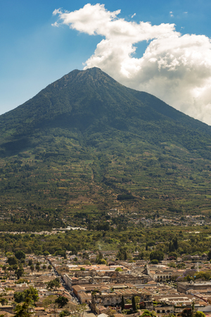 View of the city of Antigua, Guatemala with Volcan de Agua behind in Central Americaの写真素材