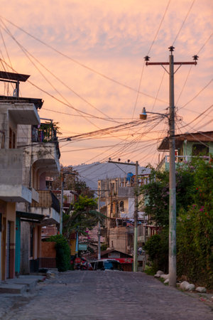 PANAJACHEL, GUATEMALA - MAY 21, 2018: Empty street at sunrise in the tourist town of Panajachel,...