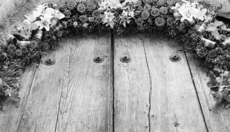 Floral arrangement on old wood with copy space in stunning black and whiteの写真素材