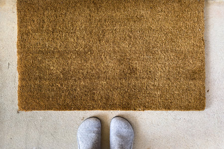 A pair of shoes at the front door matの写真素材