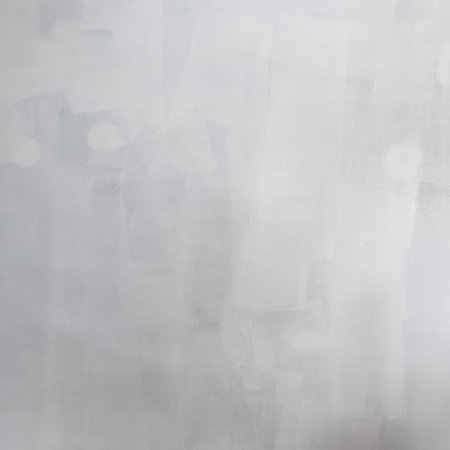 Completely blank freshly roller painted white wall with patchy marks in the first coat with texture as backgroundの写真素材