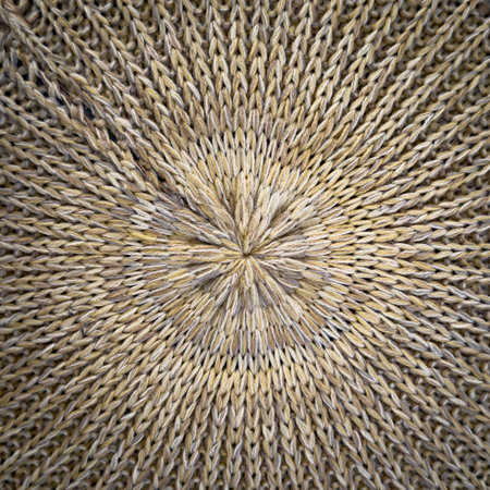 Woven material background texture radiating outward from a central pointの写真素材