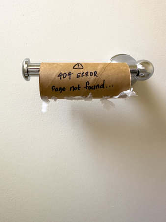 An empty toilet roll with a 404 not found error on itの写真素材