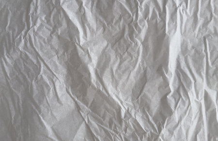 White tissue paper with wrinkles and creases background textureの写真素材