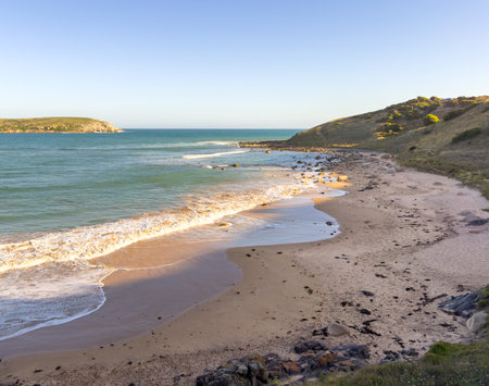 View along Kings Beach on the Fleurieu Peninsula in South Australia at sunsetの写真素材