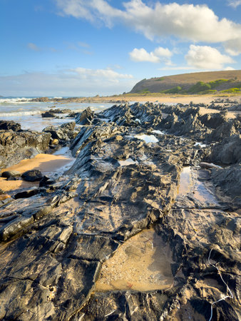 Landscape views of rocks and ocean from beaches along the Victor Harbor Heritage Trail on the Fleurieu Peninsula in South Australiaの写真素材