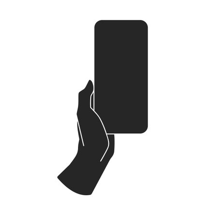 A persons hand holding a cell phone or mobile phone mockup with a blank screen for copy space in black fill silhouette vectorのイラスト素材