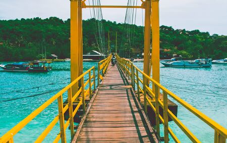 Yellow bridge. Sunny photo, summer day. Journey to Baliの写真素材