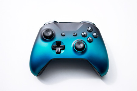 Blue black gradient gamepad from the game console isolated on a white background,の写真素材