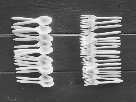 spoons and forks on the table in black and whiteの写真素材