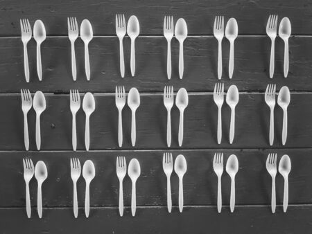 spoons and forks on the table in black and whiteの写真素材