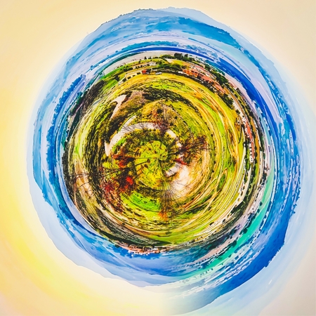 green nature with blue sky in small planetの写真素材