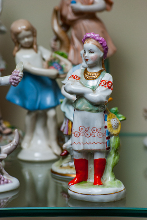 Porcelain rare figures standing in a glass caseの写真素材