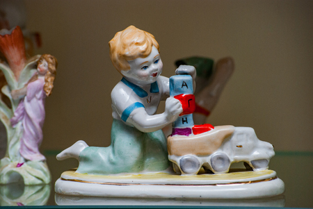Porcelain rare figures standing in a glass caseの写真素材