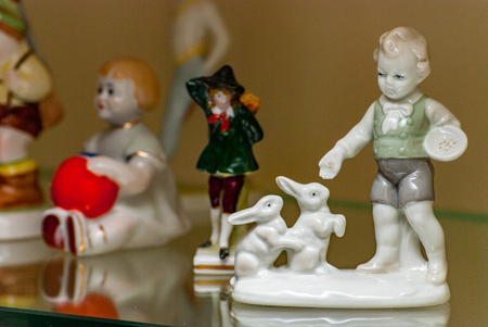 Porcelain rare figures standing in a glass caseの写真素材