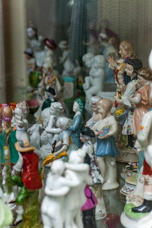 Porcelain rare figures standing in a glass caseの写真素材