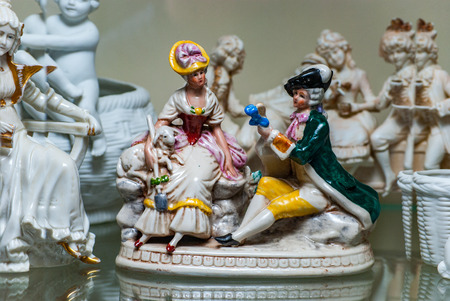 Porcelain rare figures standing in a glass caseの写真素材