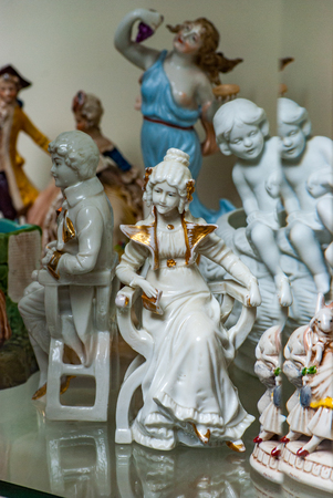Porcelain rare figures standing in a glass caseの写真素材