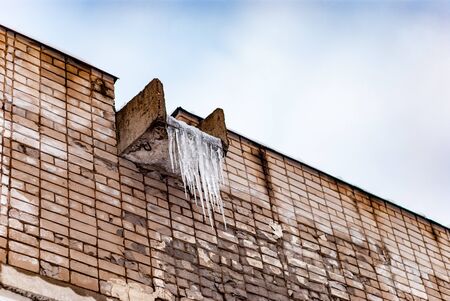 Old school facade with iciclesの写真素材
