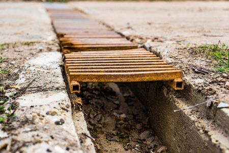Drainage with rusty barsの写真素材