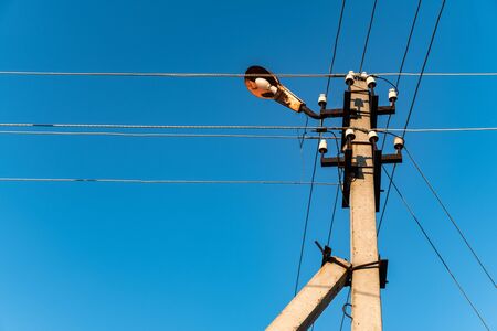 Reinforced concrete light poles in village