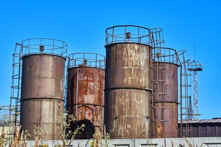 Tanks for waste oil against the blue skyの写真素材