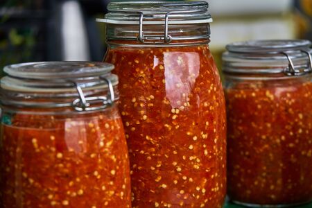 Grinded hot pepper in jarsの写真素材