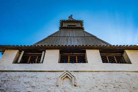 Stone lookout tower of the ancient Kremlin against the blue skyの写真素材