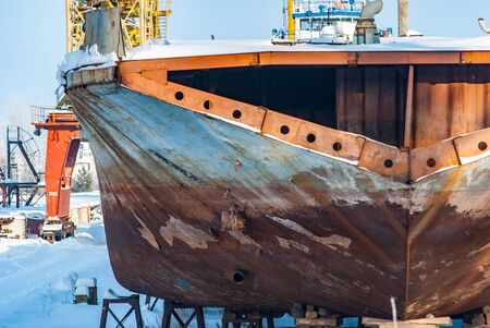Abandoned rusty ships ahead of sawing for scrapの写真素材