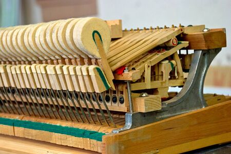 Wooden hammers of the old disassembled grand pianoの写真素材