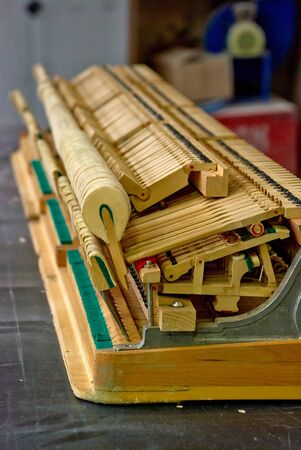 Wooden hammers of the old disassembled grand pianoの写真素材
