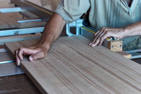 Panel squaring saw before sawing a thick edged oak board