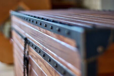 Wooden chest made of solid teak and aged metalの写真素材