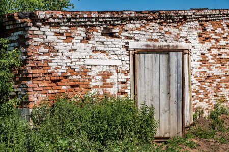 Abandoned brick barn ready for demolition in the villageの写真素材