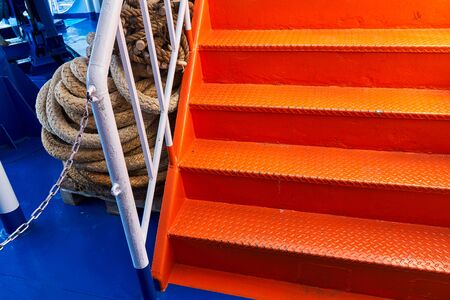 Metal ladder on the ship painted in bright orange colorの写真素材