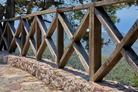 Old wooden fence located high in the mountainsの写真素材
