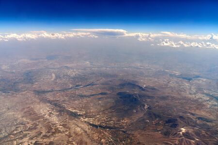 View of the mountainous terrain from the airplaneの写真素材