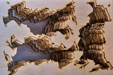 Remains of the plywood after cutting out the shapes with a laser