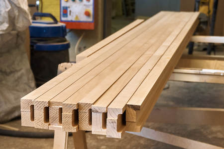 Woodworking joinery. Wooden glued beams from alderの写真素材
