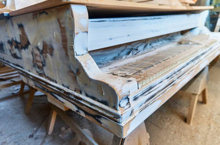 Wood processing. Joinery work. Restoration of a grand pianoの写真素材