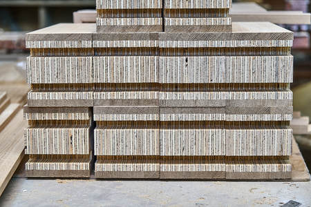 Wood door manufacturing process. Door frame elements. Woodworking and carpentry production. Furniture manufacture. Close-upの写真素材