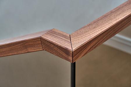 Beautiful modern glass railing for wooden staircase with wooden handrailの写真素材