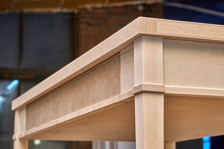 Beautiful professionally made wood writing desk in process of production in workshop. Furniture...