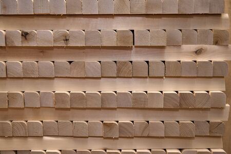 Wooden table legs. Stacked wooden table legs in workshop. Furniture manufacture