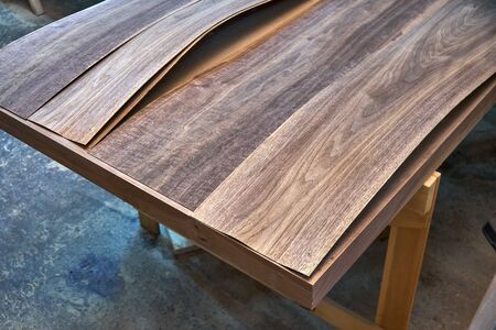Walnut veneer. Wood texture. Woodworking and carpentry production. Close-up. Furniture manufactureの写真素材