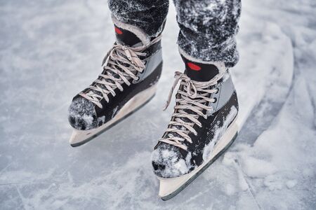 Hockey skates on the player feet after ice hockey. Close-upの写真素材