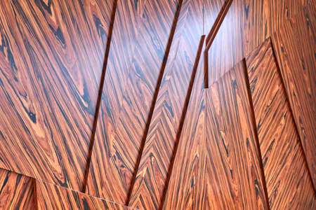 3D wood wall panels. Wood veneer wall panels elements are covered with dust. Rosewood reconstituted veneer. Furniture manufacturing. Closeupの写真素材
